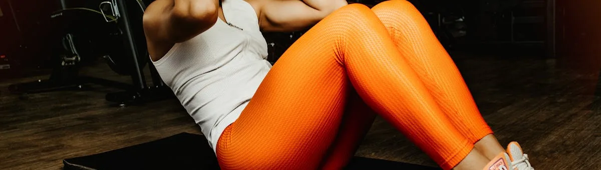 Gas string trimmer cutting tall grass along a property fence line